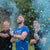 close up of men releasing blue confetti cannons